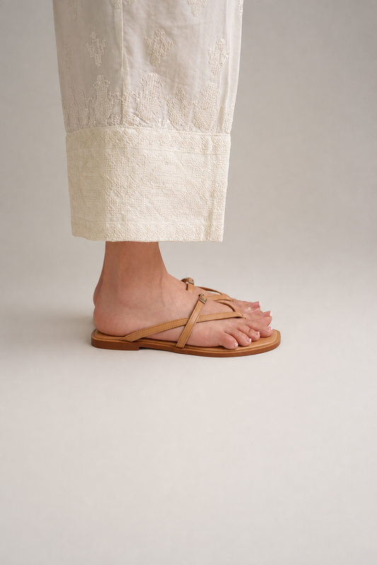 Beige toe post flat sandals with gold buckle and square toe