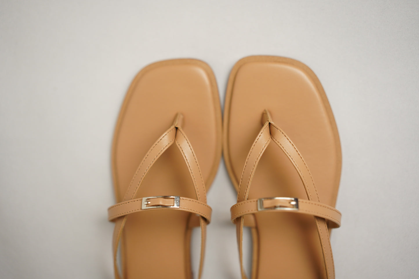 Nova beige flat sandals side view with crossover strap